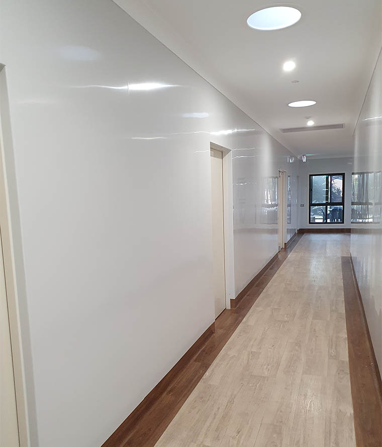 Hallway walls cladded with Inteviron wall protection